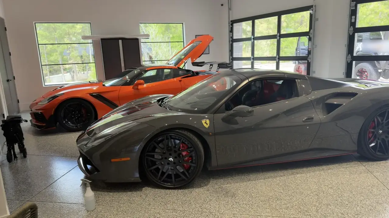 Gray Ferrari 488 and orange Corvette ZR1 after a detail in a private garage